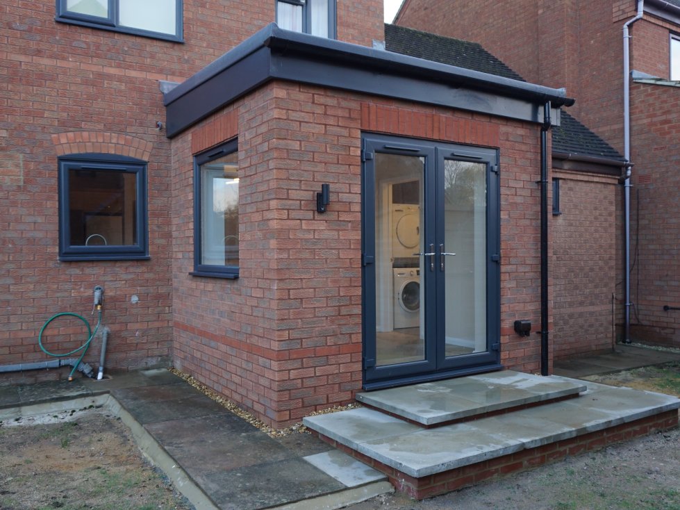 Modern single storey rear extension in Loughton with large view window and French doors